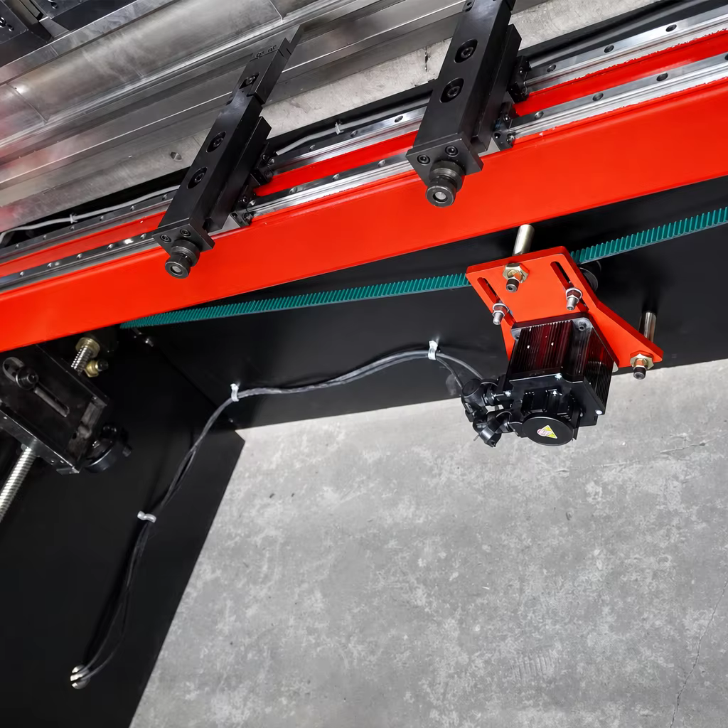 Motorized CNC rear backgauge axis mechanism with timing belt, drive motor and stop fingers