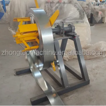 Manual decoiler with expanding core shaft and manual brake